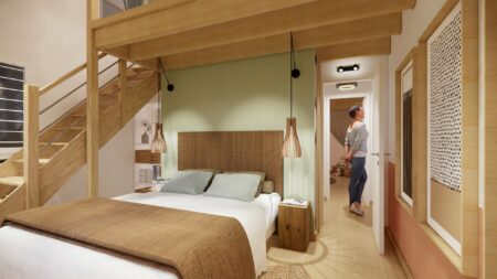 Vue d'ensemble de la chambre avec mezzanine, dressing et salle de bain dans une suite parentale à Orvault